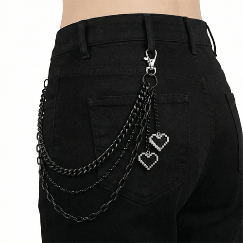 Black layered heart wallet chain with pixel charms attached to black jeans