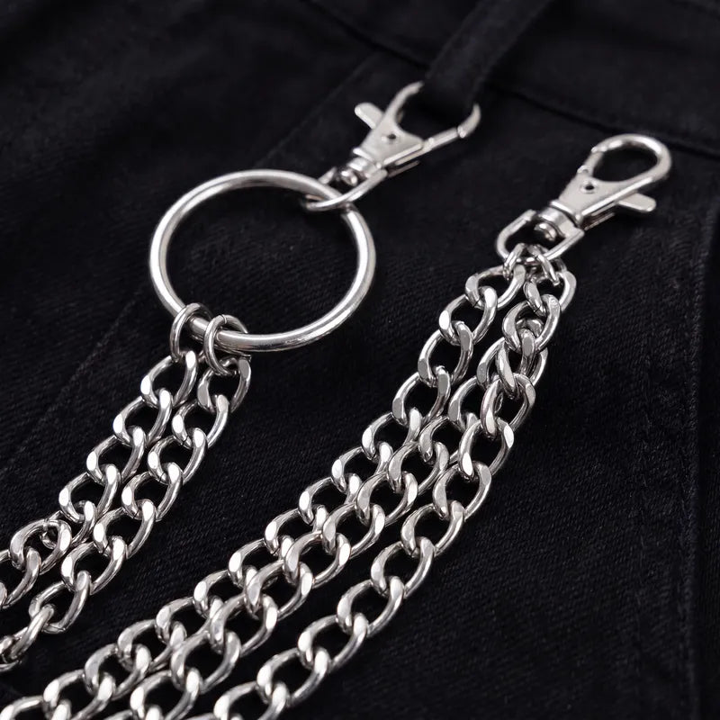 Close-up of the lobster clasps and silver chain links on the triple layered pants chain
