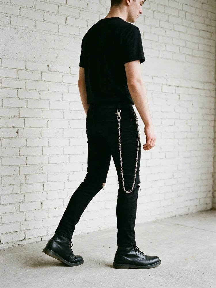 Grunge outfit with barbed wire pants chain, men