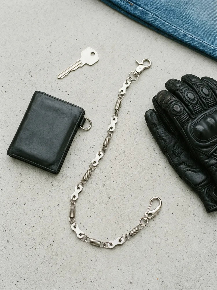 Bike chain wallet chain flat lay with wallet and riding glove