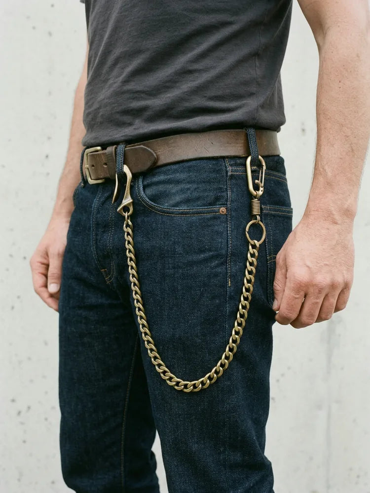 Bronze biker chain worn on raw denim jeans