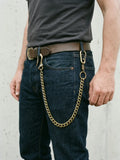 Bronze biker chain worn on raw denim jeans