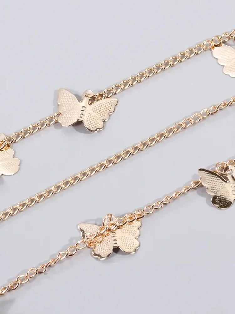 Gold butterfly charms close-up