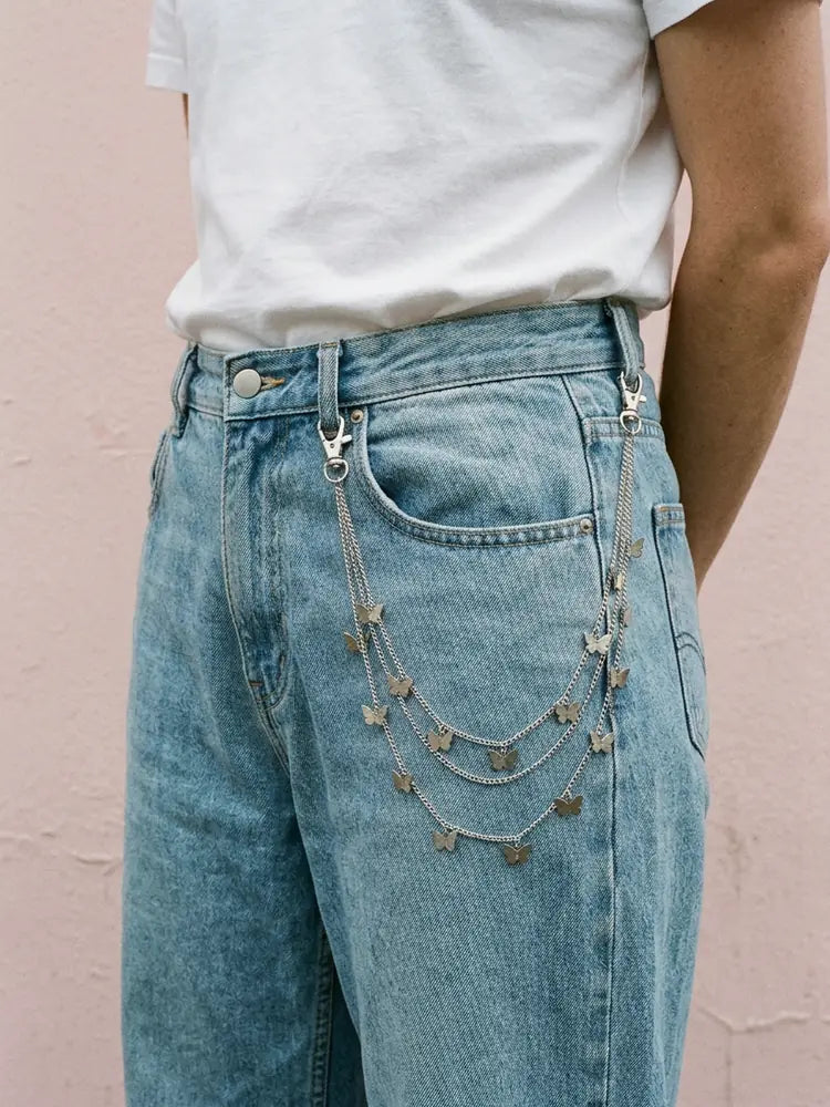 Butterfly pants chain worn on light wash jeans