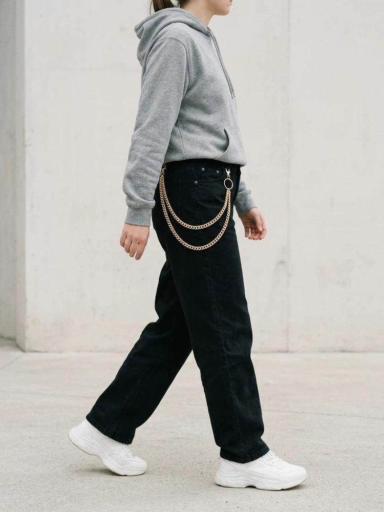 Streetwear outfit with gold layered pants chain, women