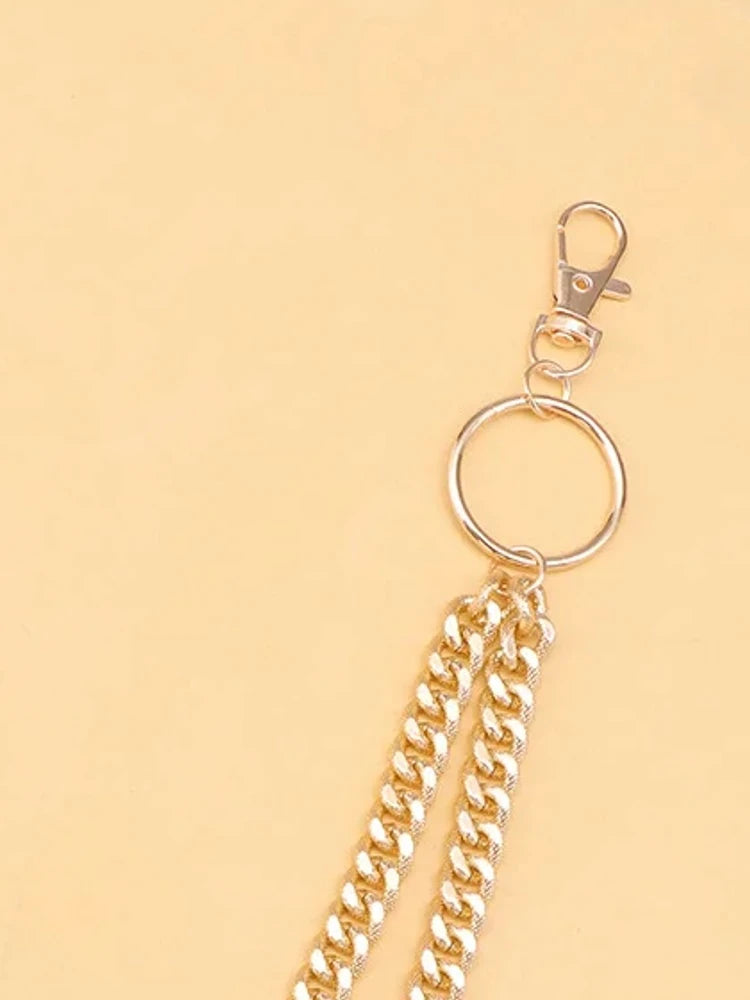 Gold curb chain close-up of O-ring and swivel clasp
