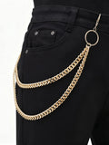 Gold layered pants chain worn on black jeans