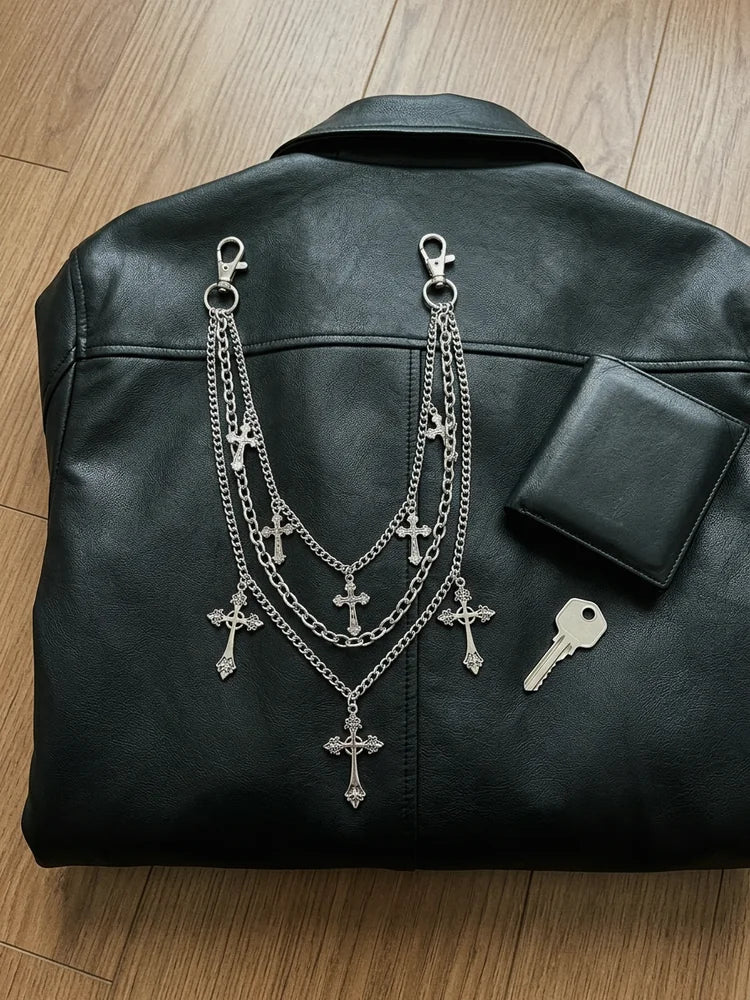 Cross wallet chain flat lay with wallet and key
