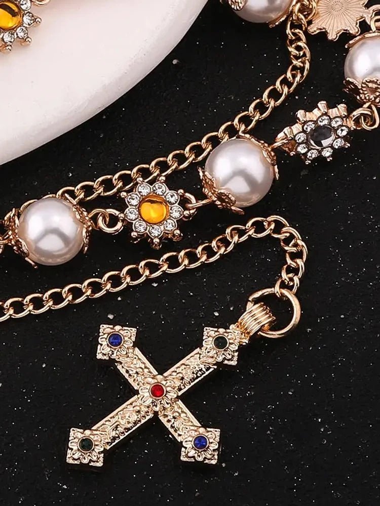 Pearl cross pants chain close-up of rhinestones
