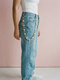 Pearl cross pants chain worn on light blue baggy jeans