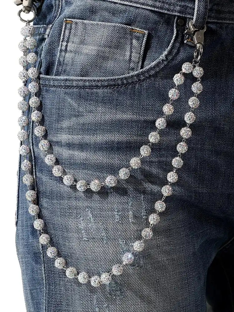White rhinestone pants chain worn on blue jeans