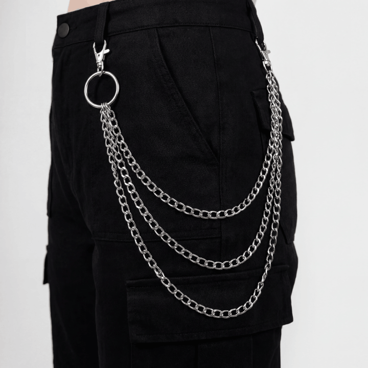 Layered triple silver wallet chain worn on black pants side view